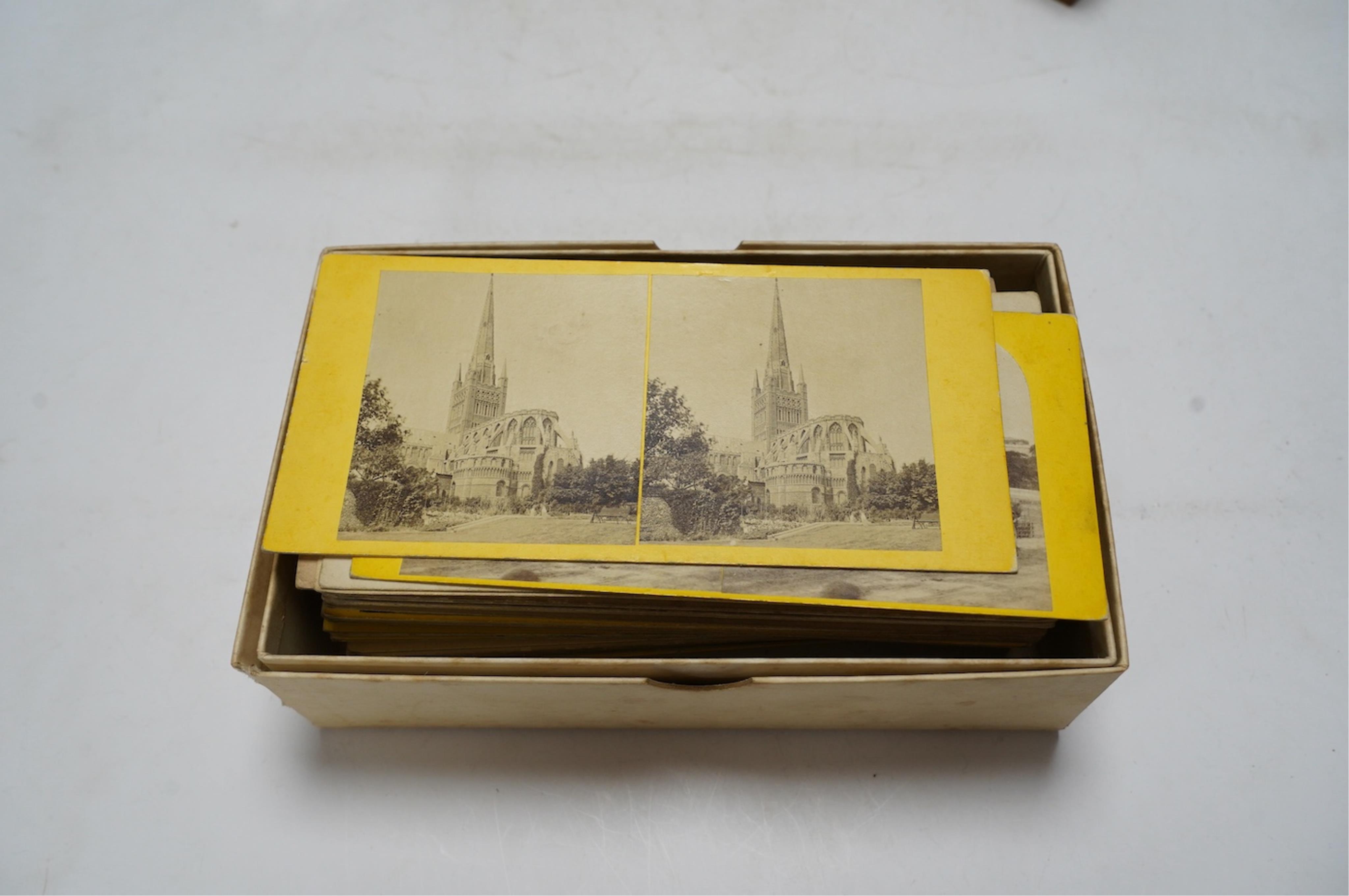 A late 19th century cased stereoscopic viewer together with topographical and other cards. Condition - fair